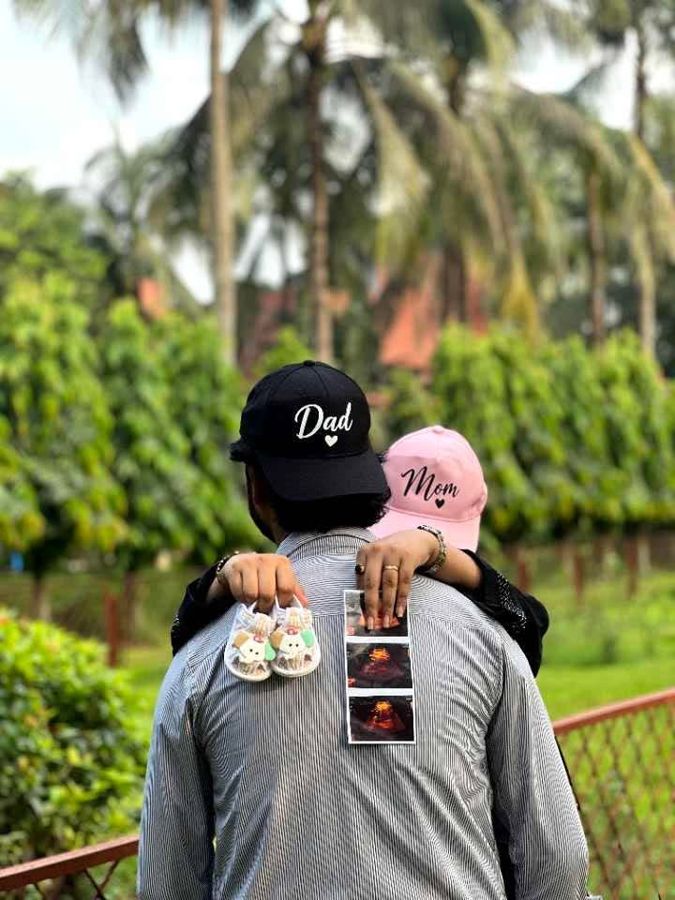 Couple wearing Dad and Mom caps